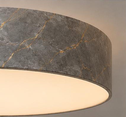 Luminaire housing finished in a stone texture